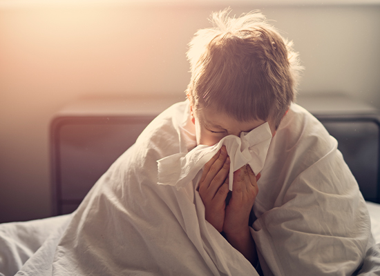 Unwell boy in a bed